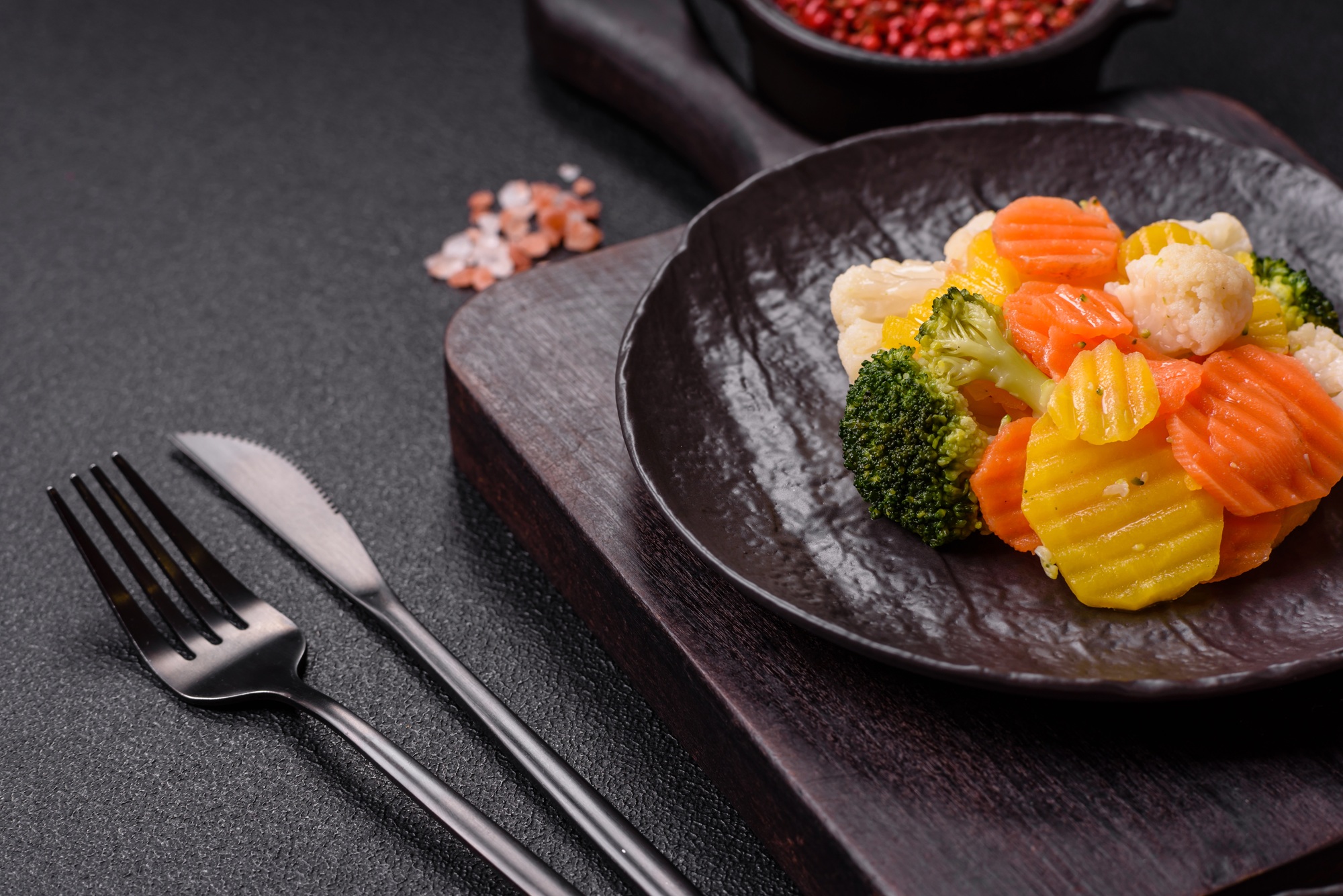 Delicious fresh vegetables steamed carrots, broccoli, cauliflower